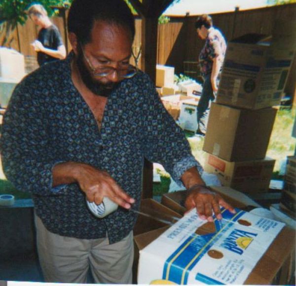 Pedro Valdez packing a computer